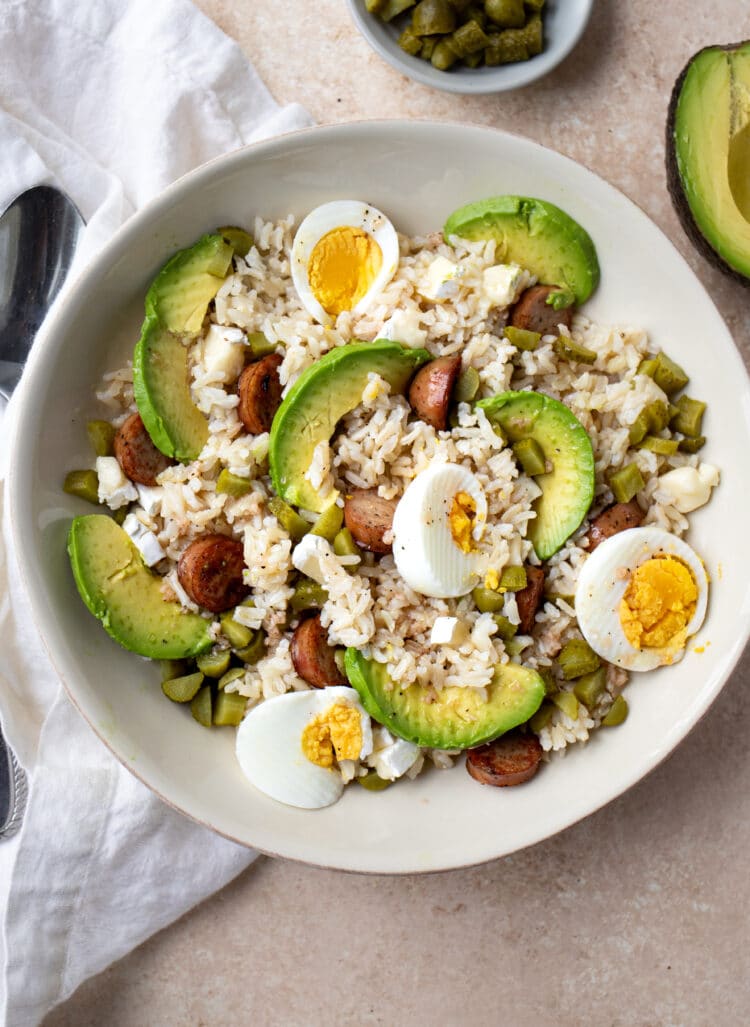 rice, hard boiled eggs, chicken sausage, avocado, and a wonderful homemade dressing comes together to create one seriously awesome meal.